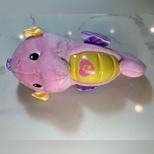 Fisher-Price Soothe & Glow Seahorse pink plush responds to baby w/8 lullabies.